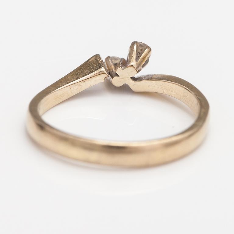 An 18K gold ring with diamonds ca. 0.12 ct in total. Finland 1974.