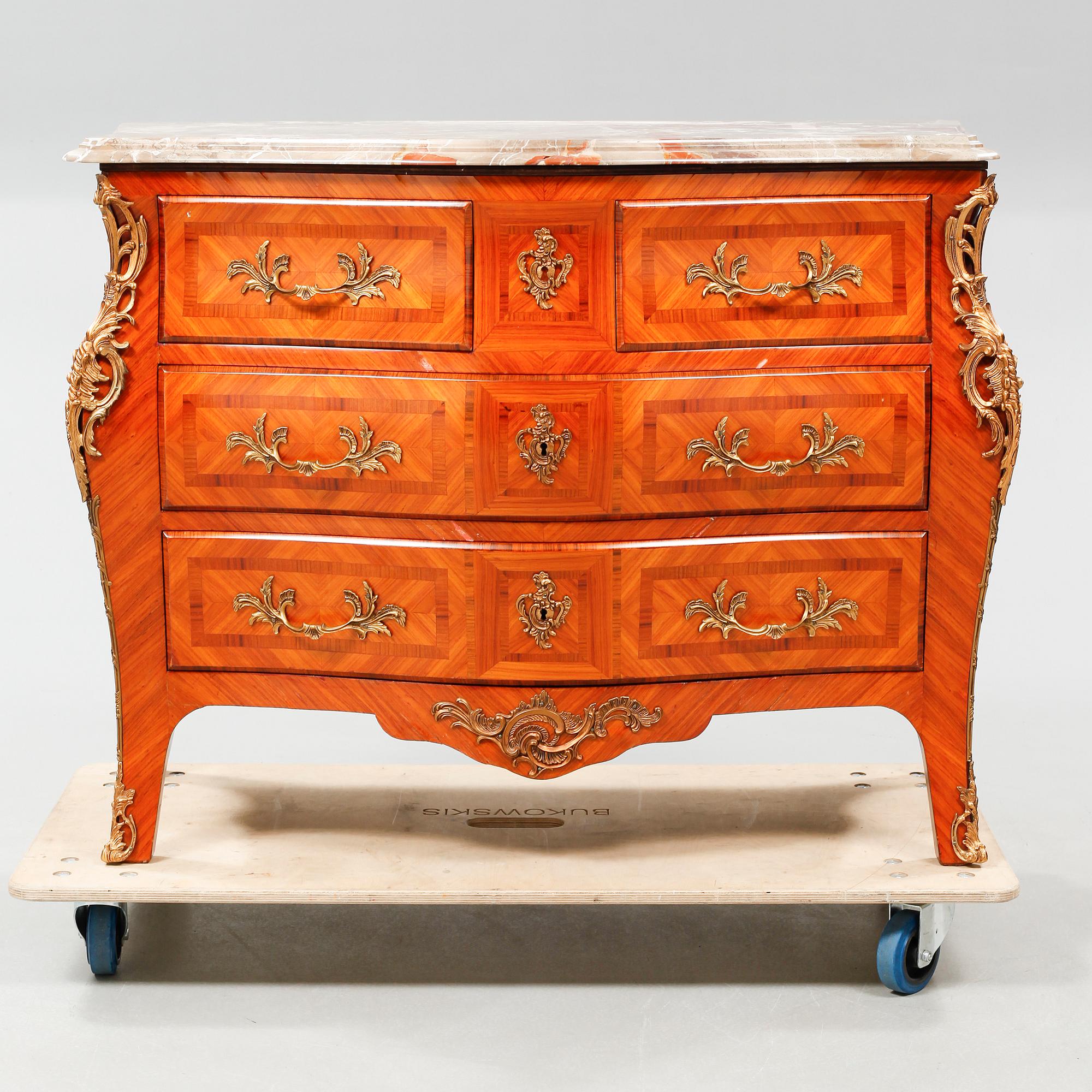 A rococo style chest of drawers, around the mid 20th century.
