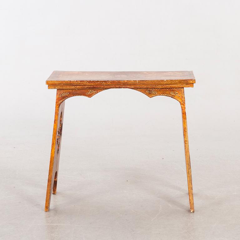 An mid 20th century wood table from Paoletti, Firenze Italy.