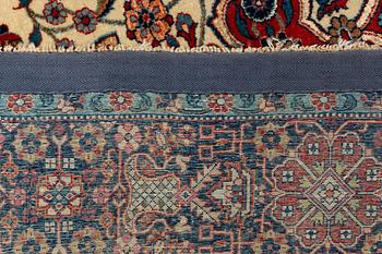 A rug, semi-antique, Teheran, part silk, 204 x 132 cm.