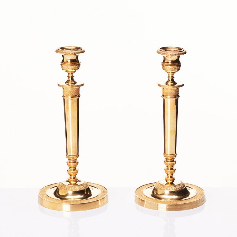 A pair of French Empire candlesticks, early 19th century.