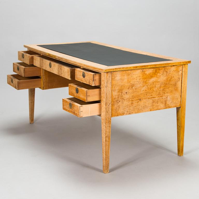 A late 19th-century curly birch veneered writing desk.