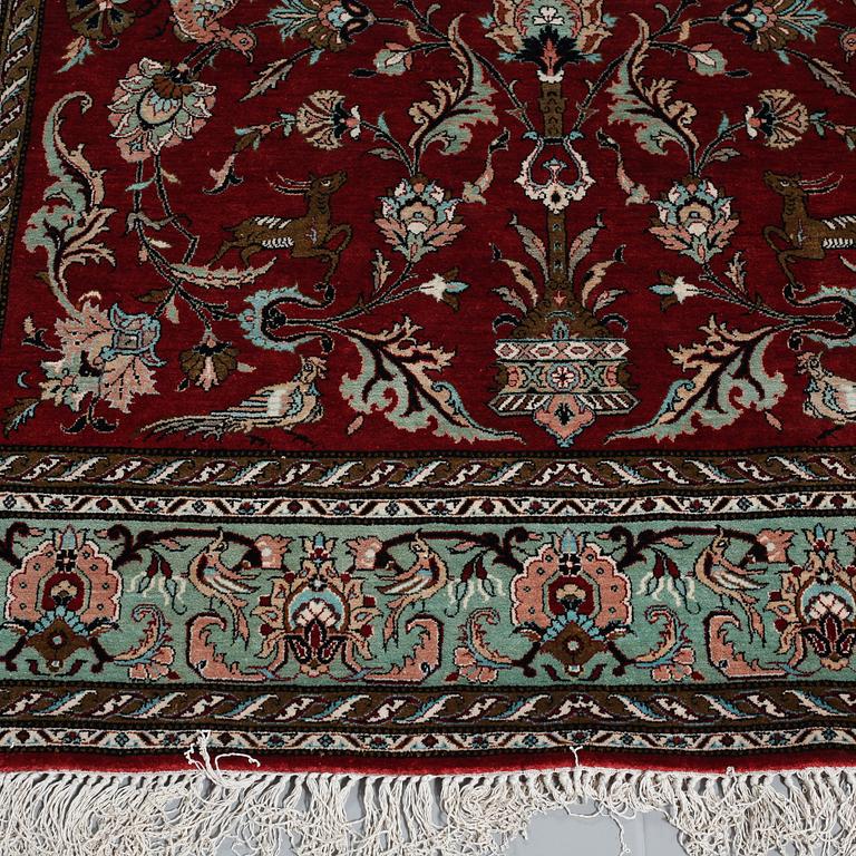 A SILK GHOM RUG, 230 x 138 cm.