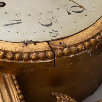 A Gustavian wall clock, late 18th century.