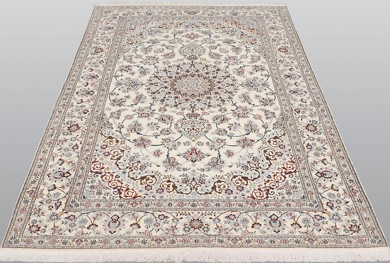 A Nain part silk carpet, 244 x 156 cm.