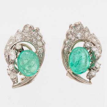 Cabochon-cut emerald and brilliant-cut diamond earrings.