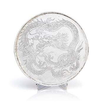 1174. A Chinese Export silver tray with a dragon, early 20th century.