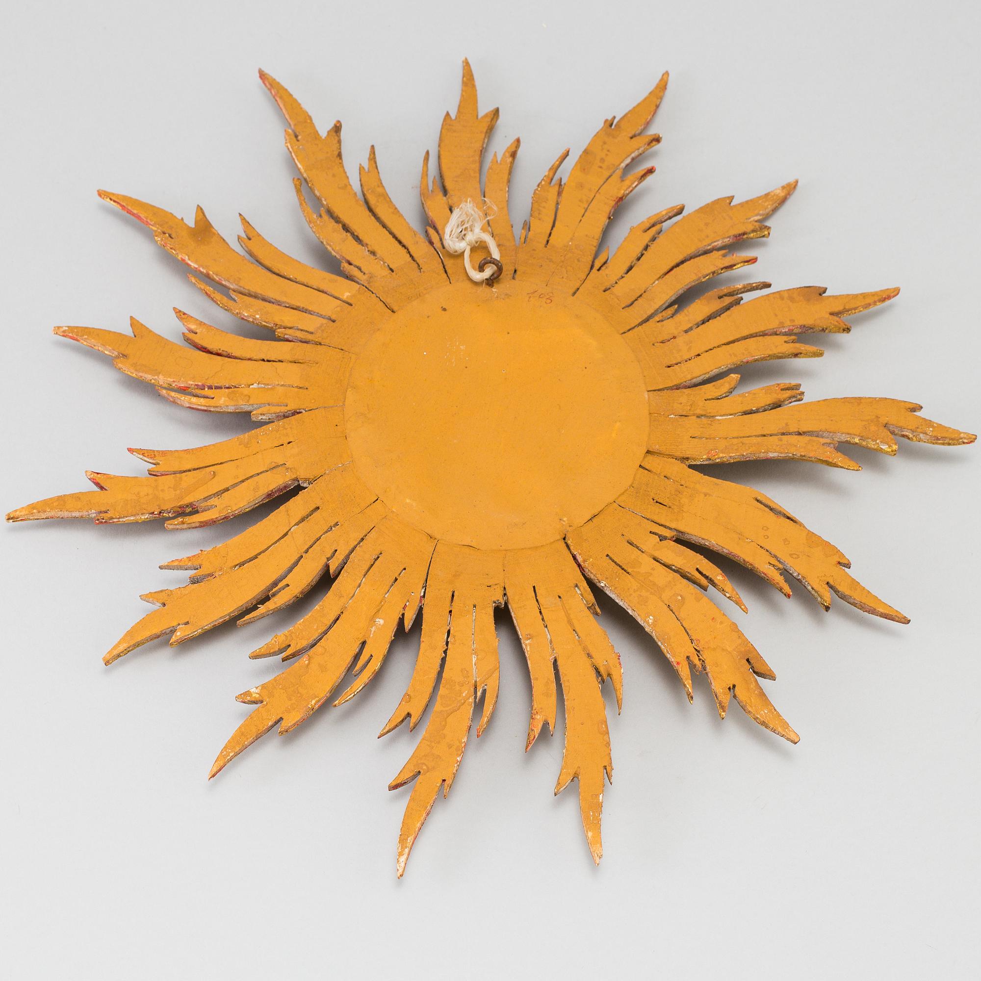 A mirror in shape of a sun, second half of the 20th century.
