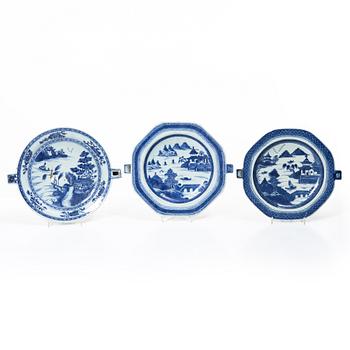 A group of three Chinese blue and white porcelain hot water dishes, Qing dynasty, 18/19th century.