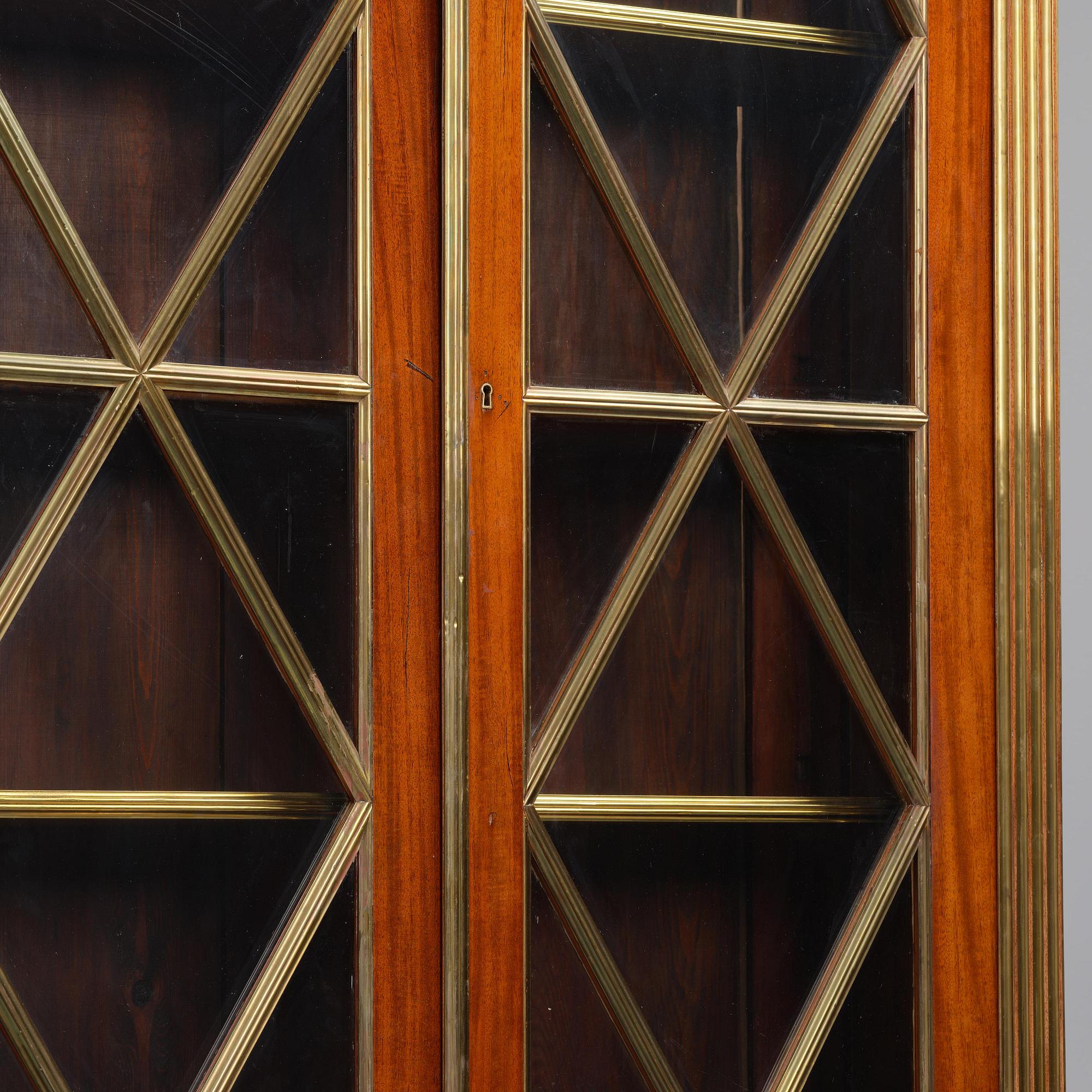 A pair of Russian mahogany and brass-mounted Jacob-style bibliothèques, modern with old parts.