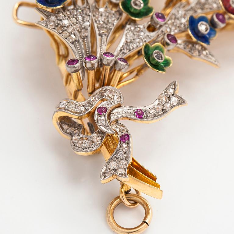 A 17K gold brooch/pendant with rose-cut diamonds, cabochon-cut rubies and enamel.
