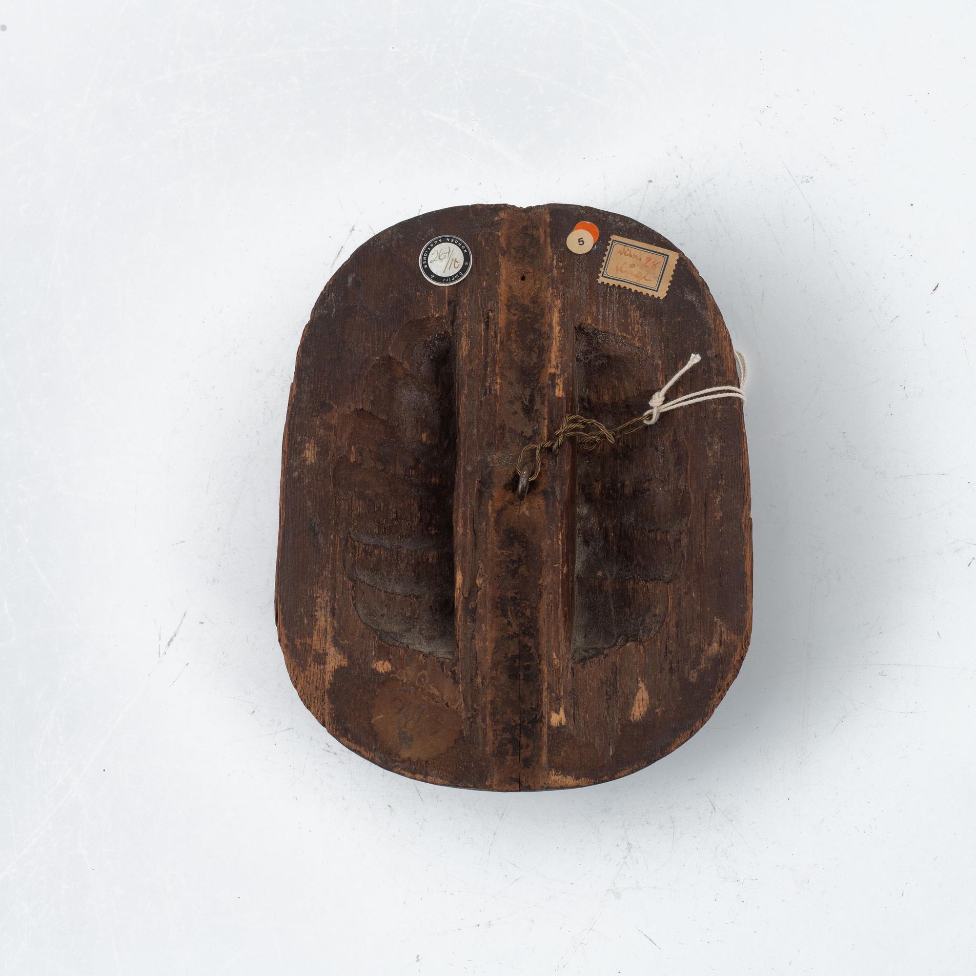 A Japanese wooden mask, Edo period (1603-1868).