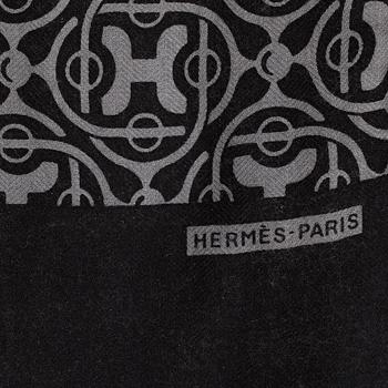 A fur scarf by Hermes.