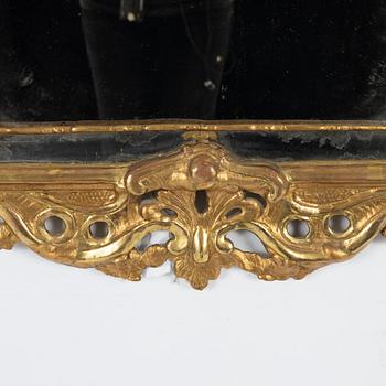 A Swedish giltwood rococo mirror, Stockholm, ltaer part 18th century.
