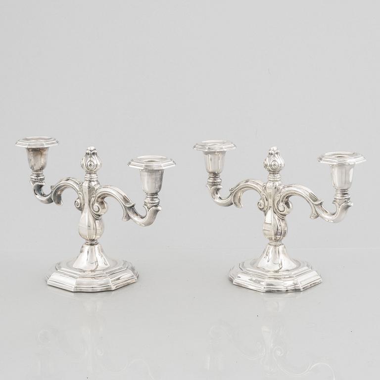A pair of Swedish silver candelabras, marks of CG Hallberg, Stockholm 1959.