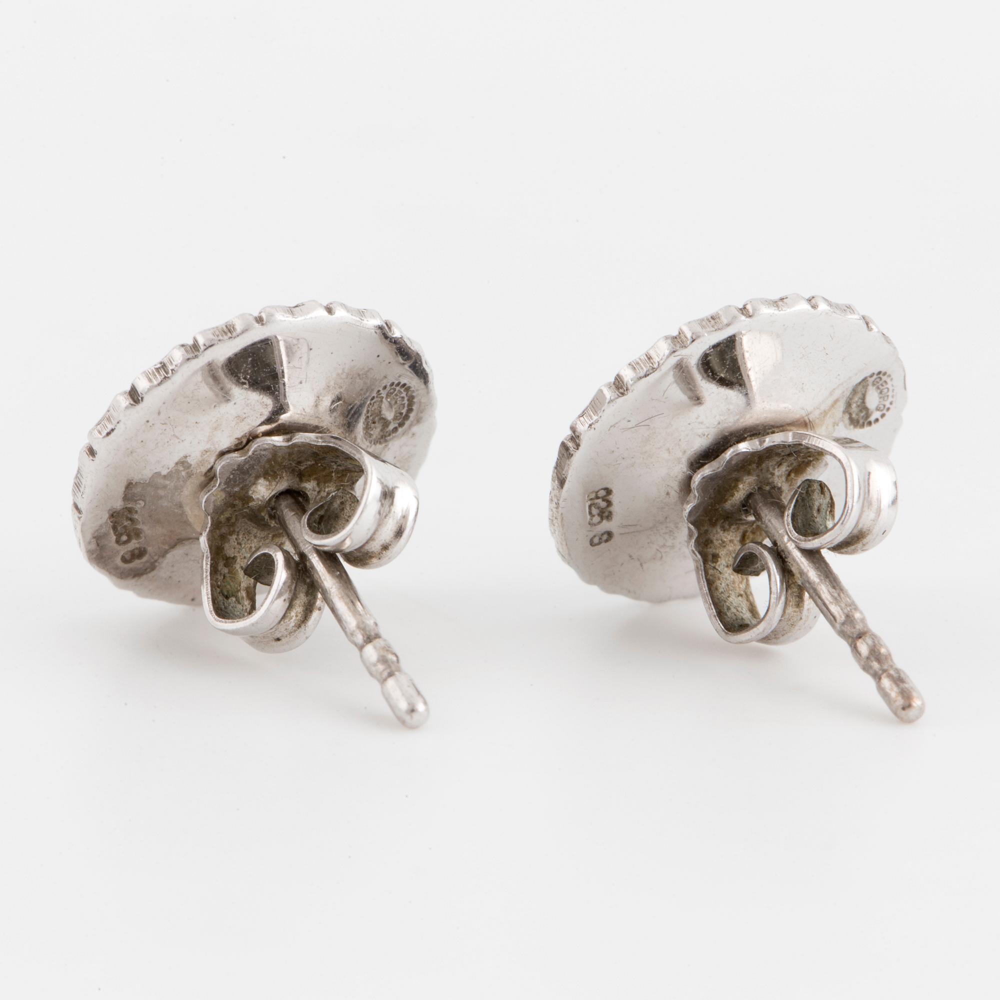 SMYCKESGARNITYR, 4 delar, Georg Jensen, 'Daisy,' sterlingsilver och svart emalj.