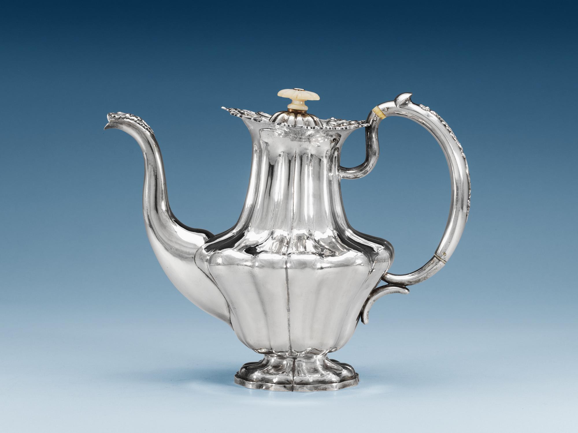 A RUSSIAN PARCEL-GILT COFFEE-POT, makers mark of Adolf Sper, St. Petersburg 1842.