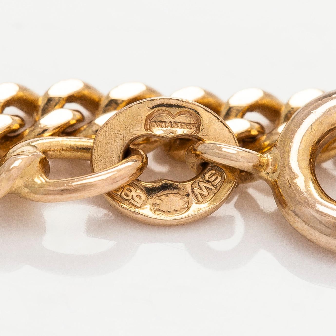 Kaulakoru, 14K ja 18K kultaa, tupsuriipuksella. Sveitsi ja Italia.