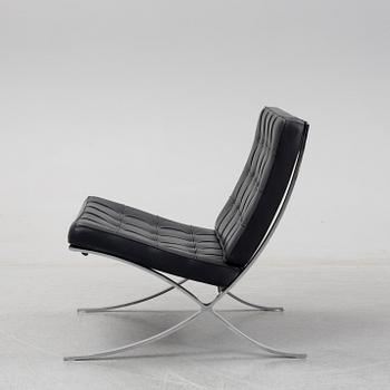 LUDWIG MIES VAN DER ROHE, a 'Barcelona' black leather lounge chair, Knoll Studio.