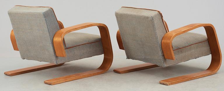 A pair of Alvar Aalto 'no 400' birch armchairs, O.y Huonekalu-ja Rakennustyötehdas A.B for Artek, Finland ca 1939.