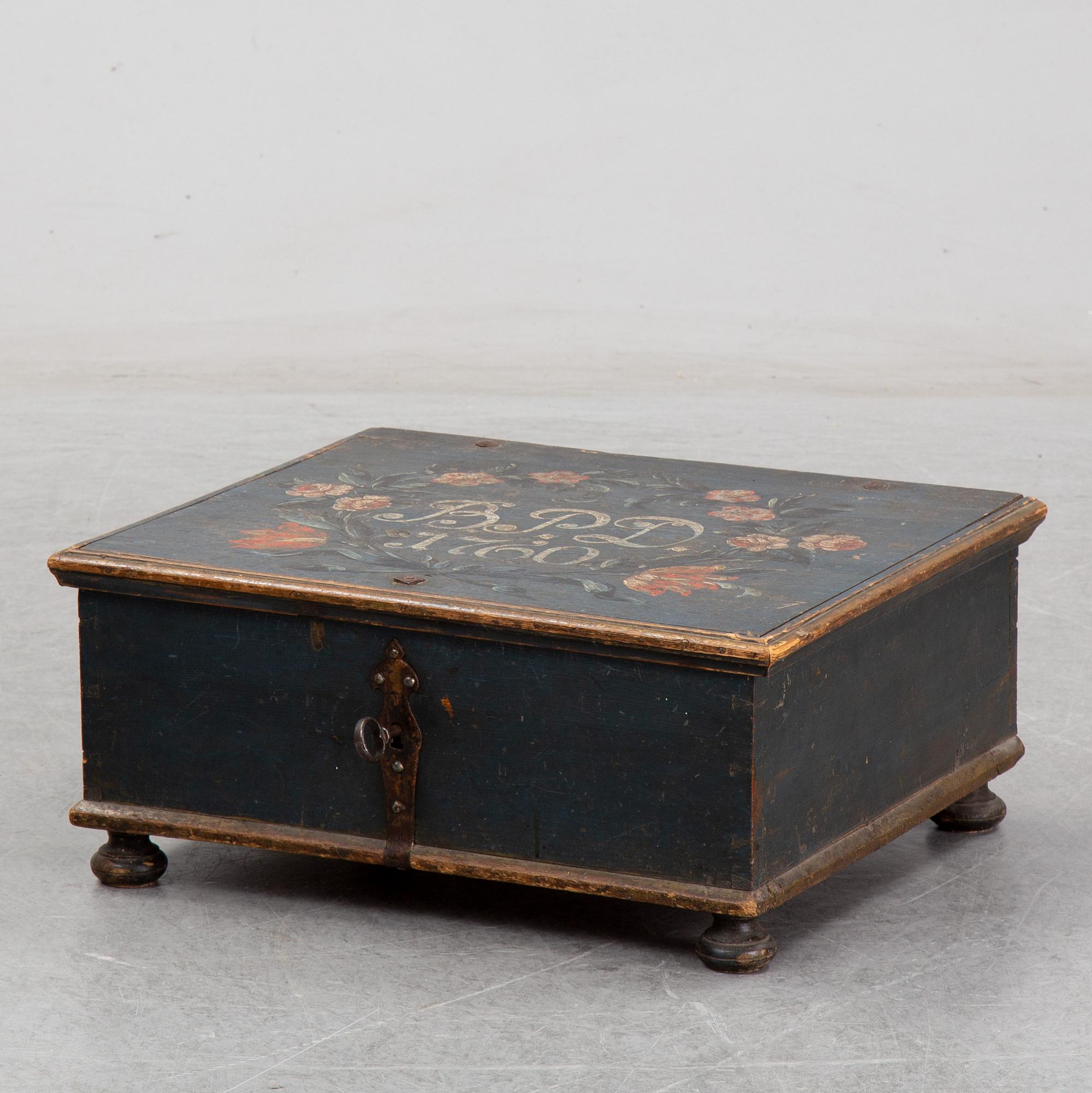 A painted wooden box, marked 1760.