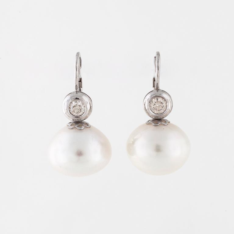 A pair of cultured pearl and brilliant cut earrings.