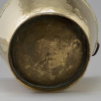 A 18th century brass bucket.