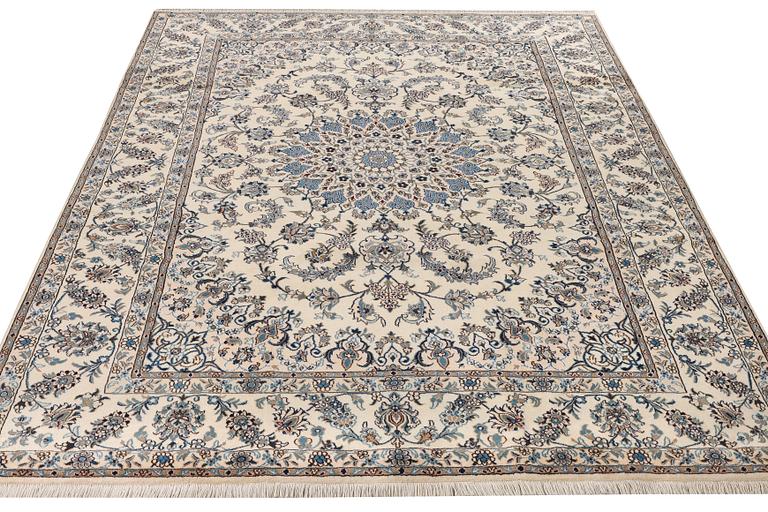 A Nain, part silk carpet, c. 337 x 244 cm.