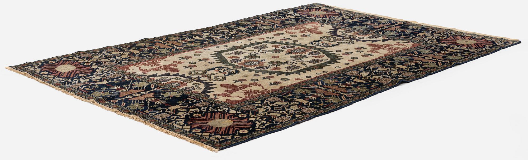 An antique Malajir rug, c. 179,5 x 124 cm (as well as one end with 2.5 cm flat weave).