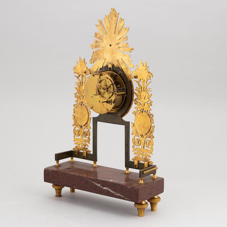 An Empire mantle clock, first half of the 19th Century.