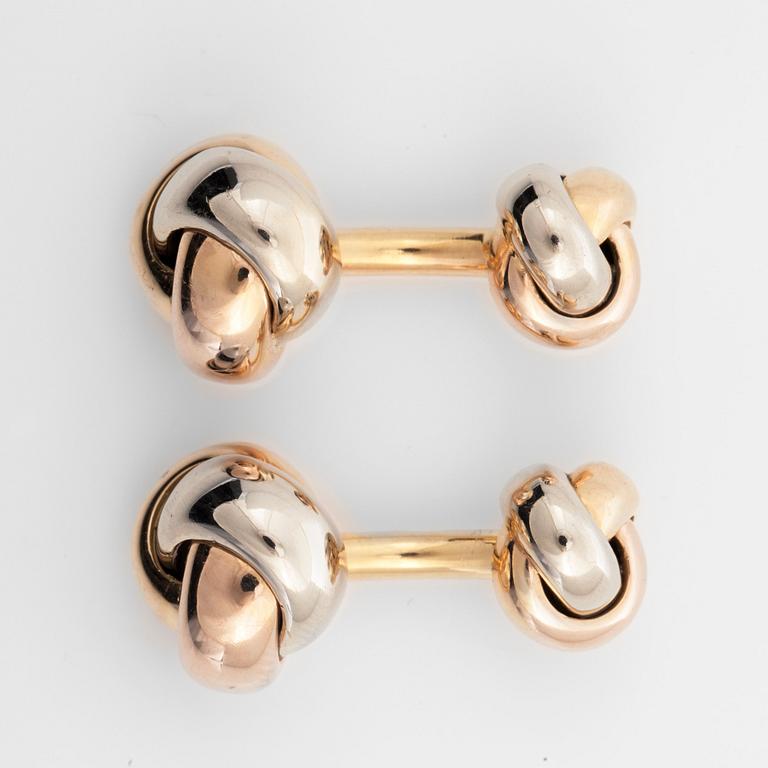 A pair of Cartier "Trinity" cufflinks. Serial number K02862.