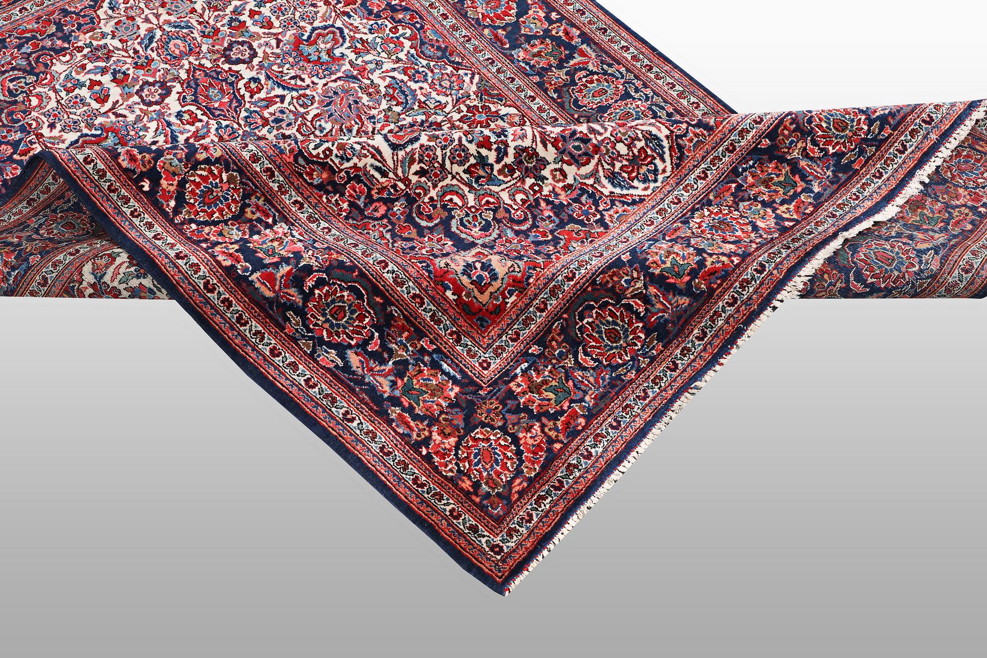 A rug, semi-antique Keshan, 217 x 134 cm.