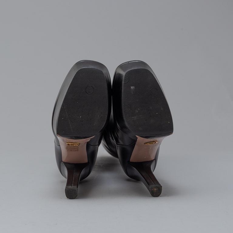 GUCCI, a pair of platform, high heel leather boots, size 37½.