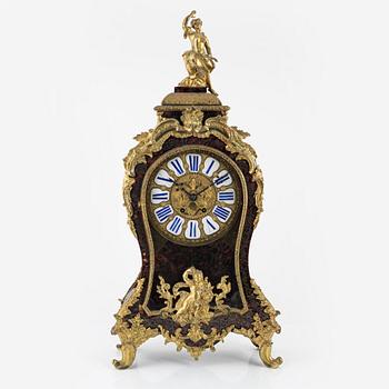 A faux tortoise and gilt bronze-mpunted Louis Xv-style cartel clock, late 19th century.