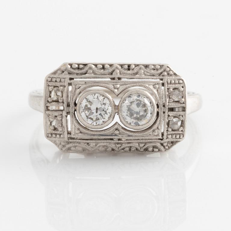 Ring with two brilliant-cut diamonds.