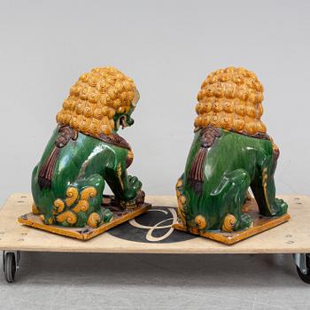 A pair of sancai-glazed chinese buddhist lions or guardian lions, early 20th century.