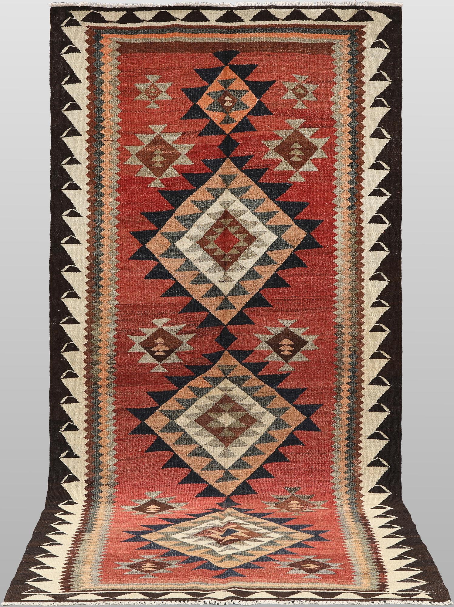 A Nomad Kurdish kilim rug, 270 x 132 cm.