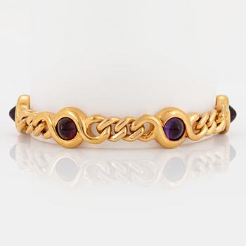 1051. A Bulgari bracelet in 18K gold set with cabochon-cut amethysts and tourmalines.