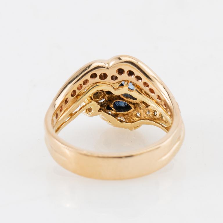 Ring in 18K gold set with pear-shaped sapphires and round brilliant and single-cut diamonds.