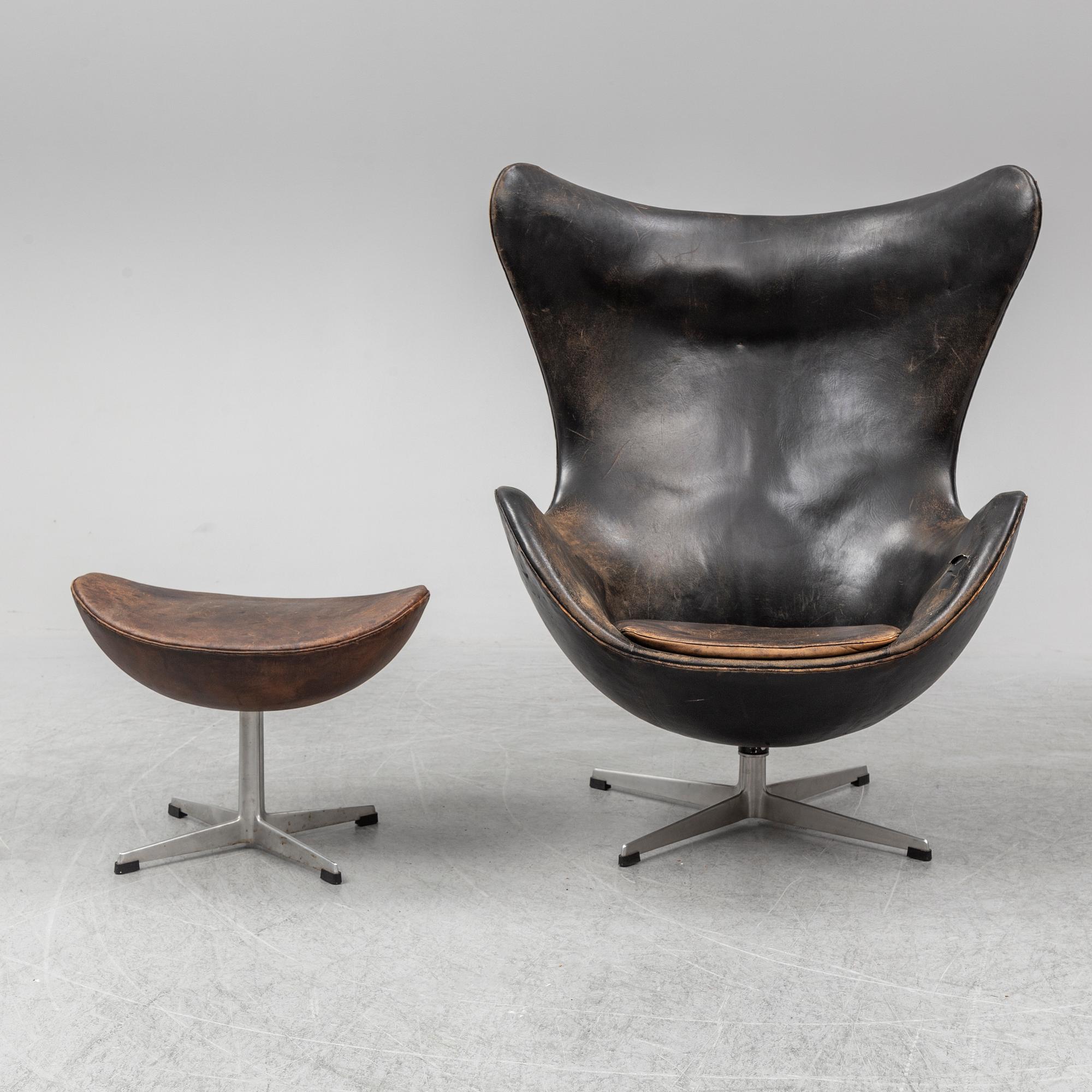 ARNE JACOBSEN, an 'Egg' leather covered easy chair and ottoman, Fritz Hansen, Denmark.
