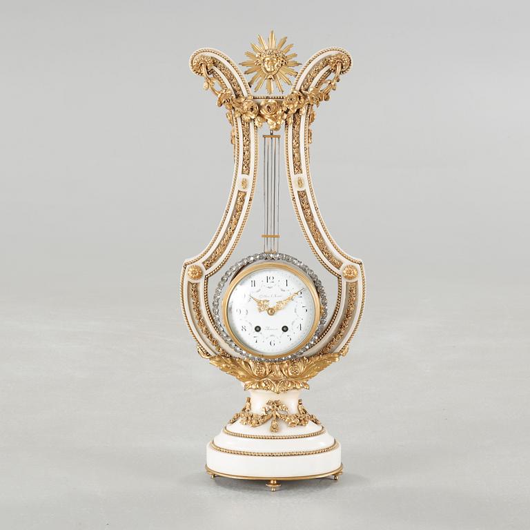 A table clock, dial marked "Gilles l'Ainé Paris", made around year 1900.