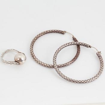 BOTTEGA VENETA, a pair of silver earrings and a silver ring.