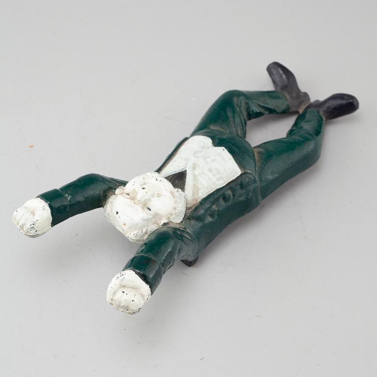 A 20th century cast iron boot jack.