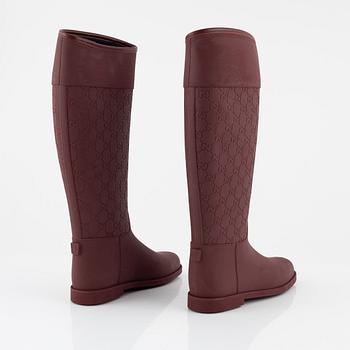 Gucci, a pair of burgundy rubber boots, Italian size 37.