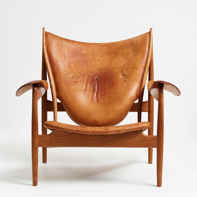 Finn Juhl, a teak and natural brown leather "Chieftain Chair" by Niels Vodder, 1950-60's.