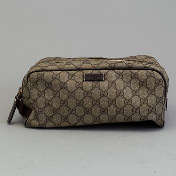 GUCCI, a monogram beauty bag.