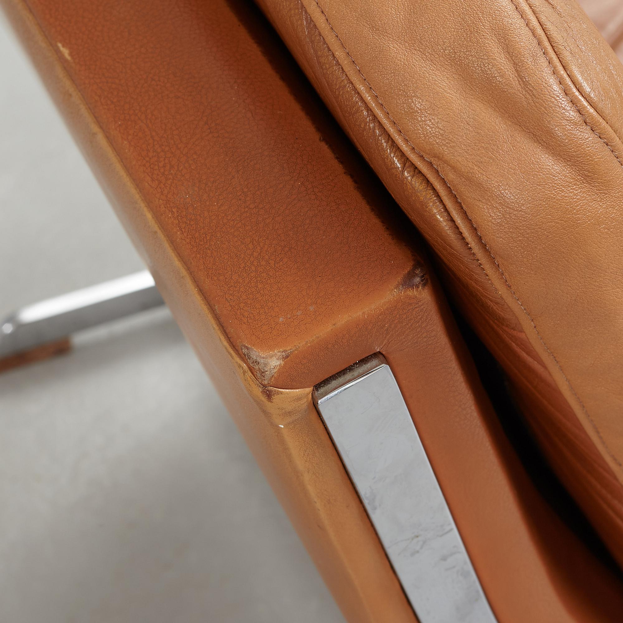 A pair of Poul Nørreklit chromed steel and brown leather easy chairs, Selectform, Denmark 1960's.
