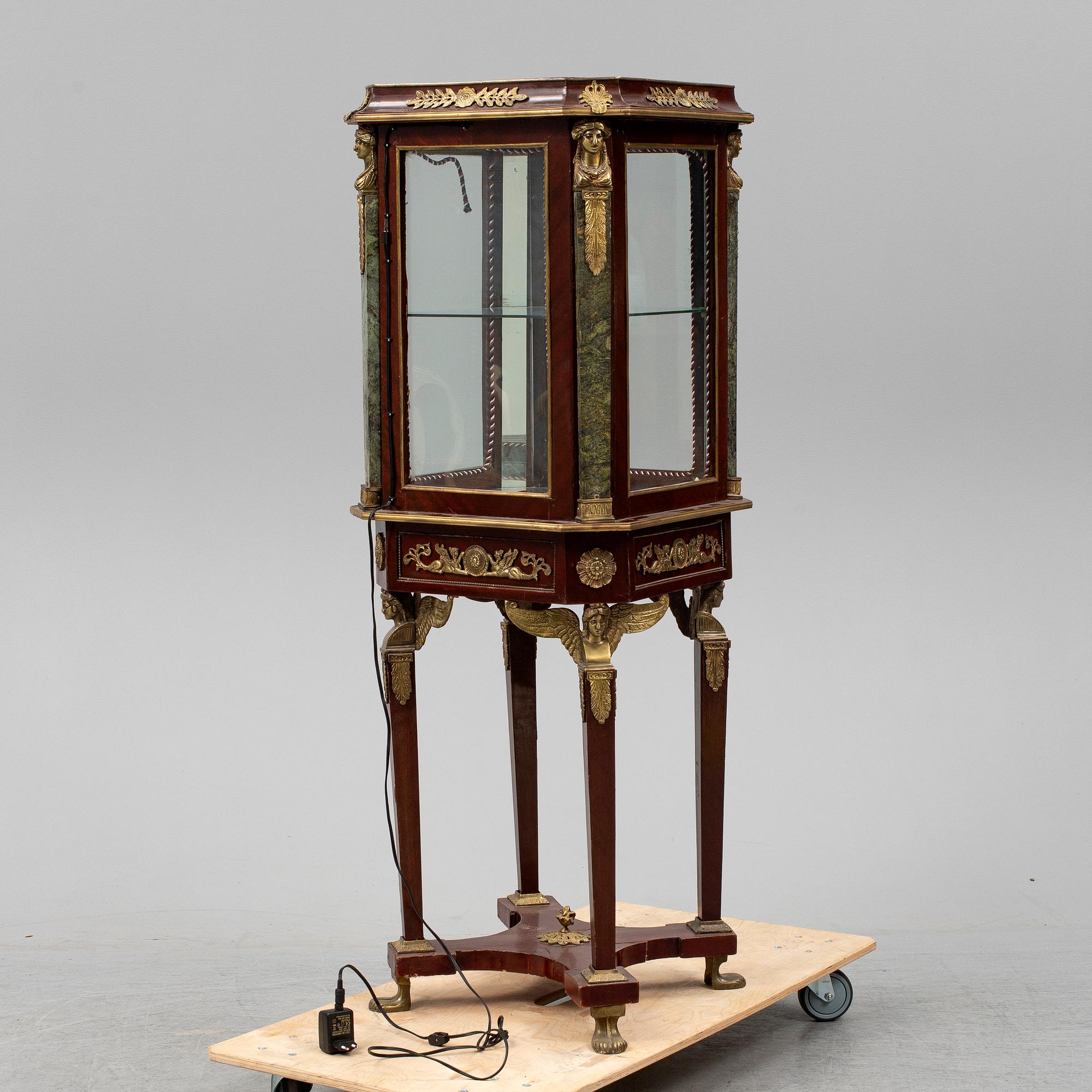An Empire style cabinet, mid 20th Century.