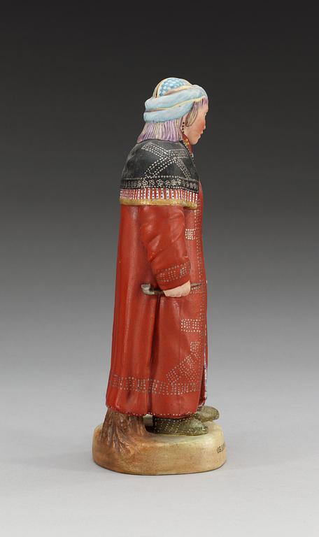 A Russian bisquit figure of a Khanty woman, Gardner (Dimitrovsk Porcelain Manufactory 1929-34),