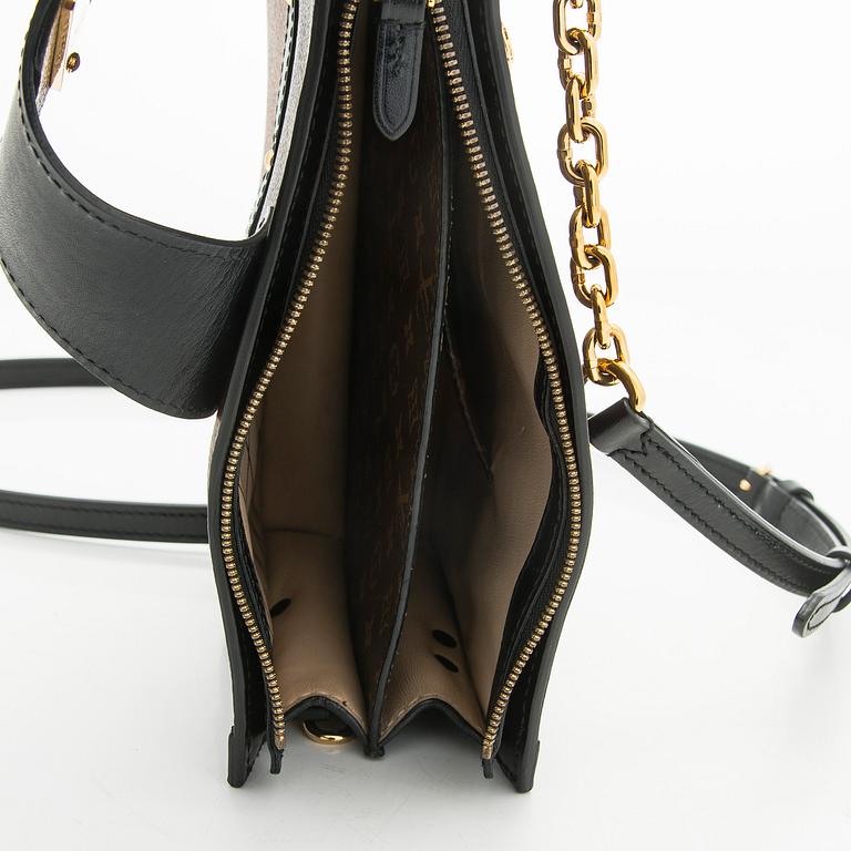 Louis Vuitton, a "Reverse Monogram Trunk Clutch" bag.